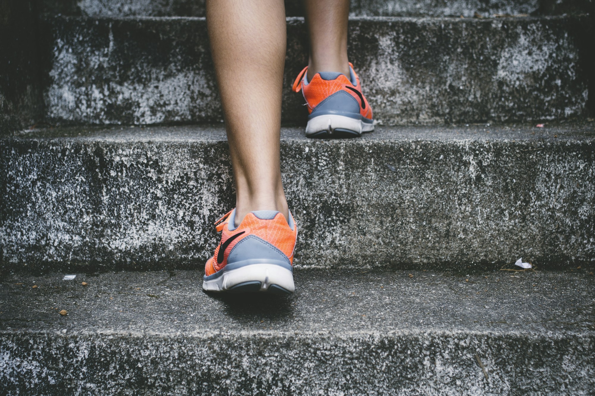 Runner climbing outdoor stairs
